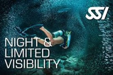 Diver swimming underwater at night, surrounded by fish with SSI logo and text 'Night & Limited Visibility'.